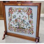 An Edwardian walnut and inlaid firescreen, with gros point panel, 27" wide