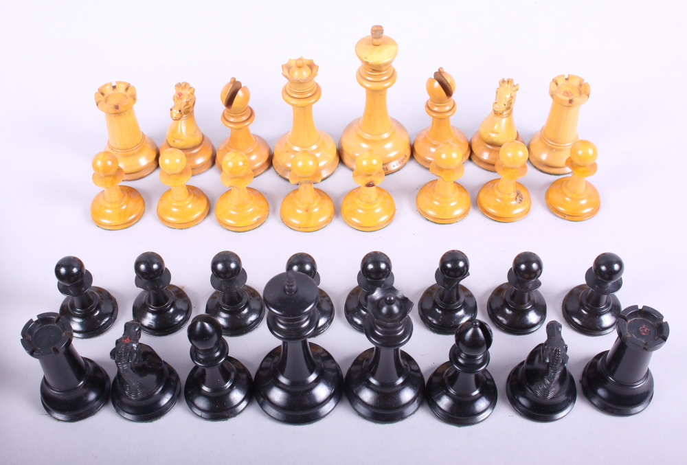 A Jaques turned boxwood and ebonised chess set (some pieces chipped)