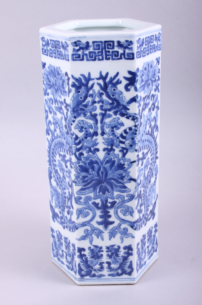 A Chinese hexagonal blue and white vase, decorated dragons and lotus, six character mark to base, 11