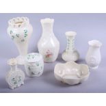 A Belleek vase with pierced rim, 7 3/4" high, a Belleek pot and cover, four other pieces of Belleek,