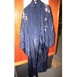 Two 20th century kimonos with embroidered floral pattern, a similar jacket and two pieces of fur