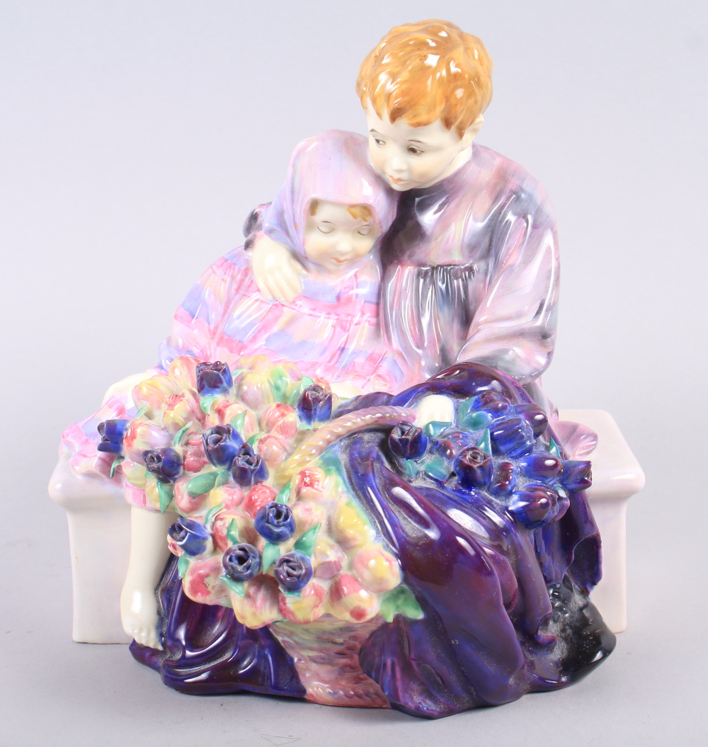 A Royal Doulton bone china figure group, "The Flower Seller's Children" HN806, 7 3/4" high (hair