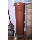 A terracotta chimney pot, 48" high