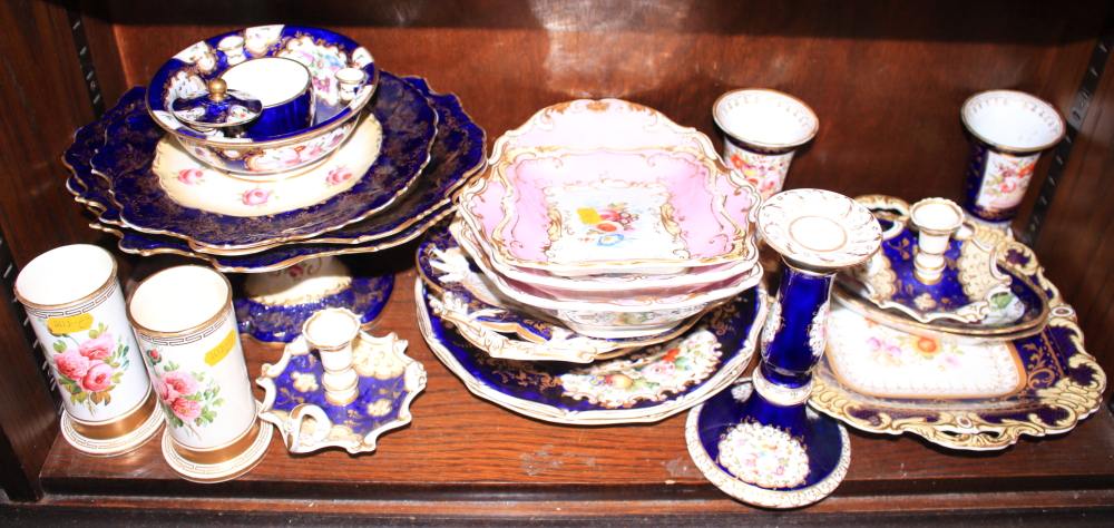 An English part dessert service, decorated flowers on a blue ground, two Spode plates, two spill