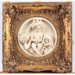 Two mounted plaques of three cherubs, in ornate gilt frames, 11 1/4" wide
