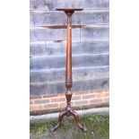 A mahogany torchere stand with carved wheat column, on tripod splayed ball and claw supports, 54"