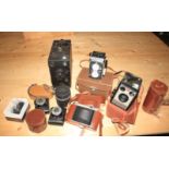 A quantity of cameras including Rolleiflex, a Voigtlander, Minolta binoculars and others
