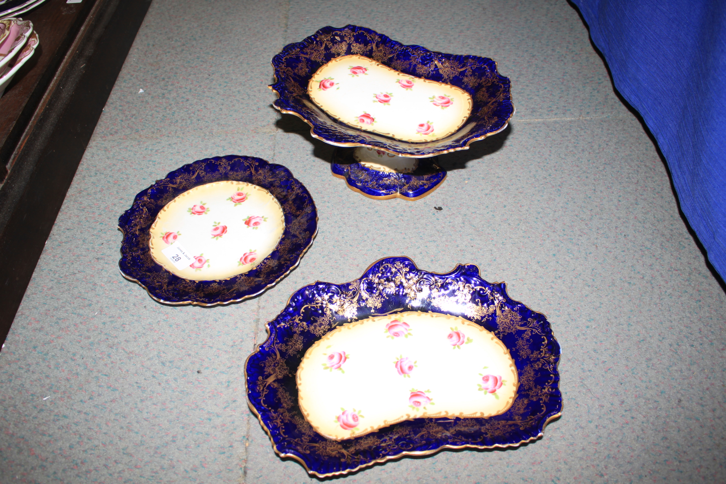 An English part dessert service, decorated flowers on a blue ground, two Spode plates, two spill - Image 7 of 28