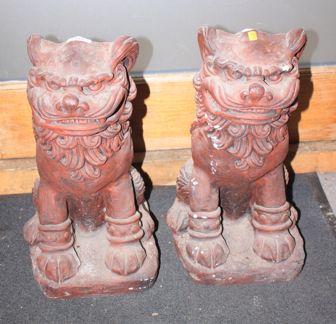 A pair of cast stone and painted Dogs of Fo, 18" high