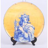 A Montigny sur Loing plate, decorated St John the Evangelist, 12 3/4" dia