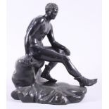 A 19th century patinated figure of seated Mercury, after the antique, 12" high