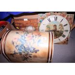 A storage box, decorated roses, a painted clock face, a doorstop, wooden model ducks and other