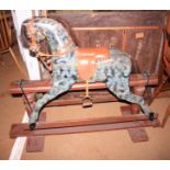 A black and grey painted rocking horse