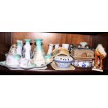 Nine sugar shakers, a china part dressing table set, butter dishes and other items