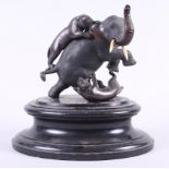 A Japanese bronze of two tigers attacking an elephant, on ebonised plinth, 9" high