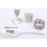A white metal model of a cobra, a silver spoon, a silver tie-clip, a Continental white metal box and