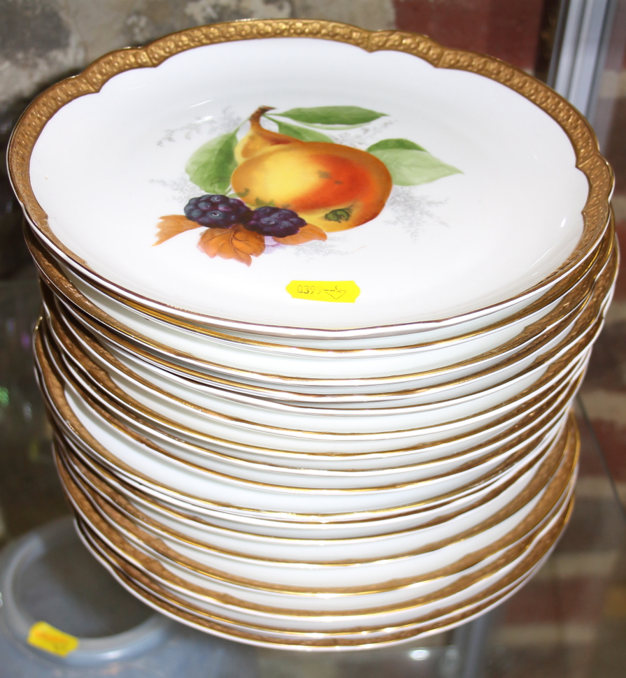 Seventeen Rosenthal shaped dishes with hand-painted fruit decoration and gilt borders, 9 " dia