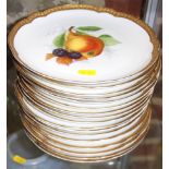Seventeen Rosenthal shaped dishes with hand-painted fruit decoration and gilt borders, 9 " dia