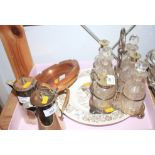 A silver plated cruet set, on stand, two hot chocolate pots, a copper and wooden ashtray, a Wedgwood