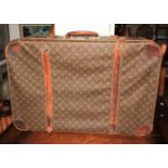 A vintage Louis Vuitton monogram pattern leather suitcase, 31" x 20"