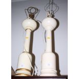 A pair of cream painted turned wood lamps, columns 24" high