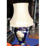 A Booths baluster-shaped lamp base, decorated birds of paradise on a blue scale ground, 11" high (