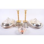 Two silver plated entree dishes, a pair of brass candlesticks, a plated toast rack, a wine bottle