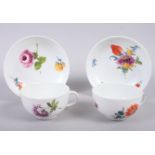 A pair of 19th century Meissen hand-decorated cups and saucers