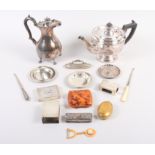 Two silver matchbox holders, a silver nail buffer, a silver box, two button hooks, a silver tray,