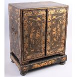 A 19th century Chinese export lacquer table cabinet, fitted six short and three long drawers, on