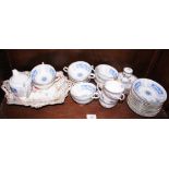 Eleven Coalport "Revelry" pattern teacups and saucers, a matching cream jug, an English porcelain