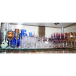 A quantity of glassware, including wines with gilt rim, champagne flutes, blue glass vases, etc