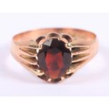 A gentleman's 9ct gold and garnet signet ring, size X, 4.6g