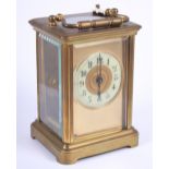 A brass cased, five-window carriage clock with white enamel dial and Arabic numerals, 4 1/4" high