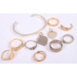 A selection of 9ct gold rings, 22.2g (some damages), a silver ring, a silver cuff bracelet and two