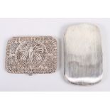 A silver cigarette case and another with filigree decoration, 10oz troy approx