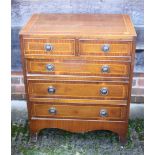 A mahogany and banded chest of two short and three long graduated drawers, on bracket feet, 24"