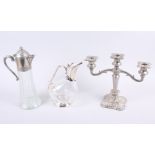Two silver plated claret jugs and a plated candelabra