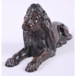 A bronze model of a Landseer lion, 12" long