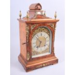 A German Lenzkirch walnut and oak cased mantel clock with brass finials, silvered dial and Roman