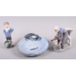 A Royal Copenhagen figure group, milkmaid and cow, 6" high, a dish decorated fish and relief crab,