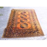 A Persian design rug decorated four central motifs and geometric designs on a yellow ground, 76" x