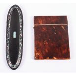 A tortoiseshell card case and a papier-mache spectacles case with mother-of-pearl inlay