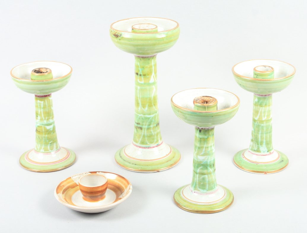 An Aldermaston pottery green glazed candlestick, by Alan Caiger Smith, 10 3/4" high, three similar