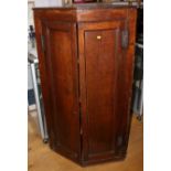 An early 19th century oak corner cupboard, 55 1/2" high