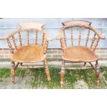 Two oak and elm seat Captain's chairs, on turned and stretchered supports