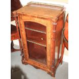 A burr walnut, box and ebony line inlaid music cabinet with brass gallery top and flanking columns