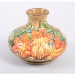 A Moorcroft "Flame of the Forest" pattern squat vase, 4" high