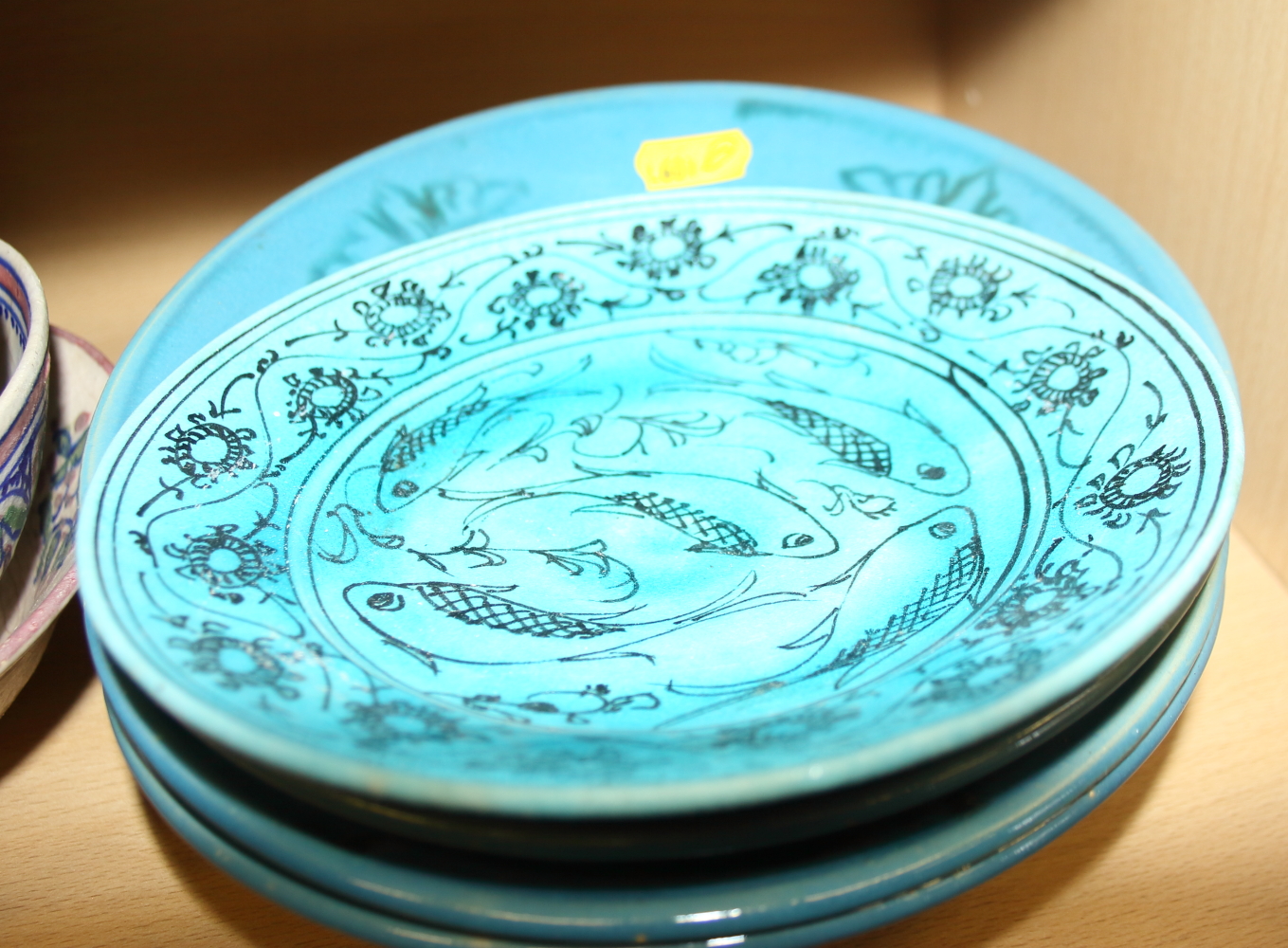 A Middle Eastern, turquoise glazed dish, decorated fish, 7" dia, other similar bowls and plates - Image 2 of 3