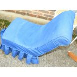 A late Victorian low seat nursing chair with blue linen loose cover, on turned and castored